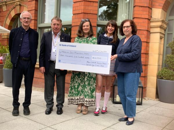 President of the Ballsbridge Lion’s Club Farrell O’Boy and Máire Ledwith handing over the cheque to Isabelle Simpson of MS